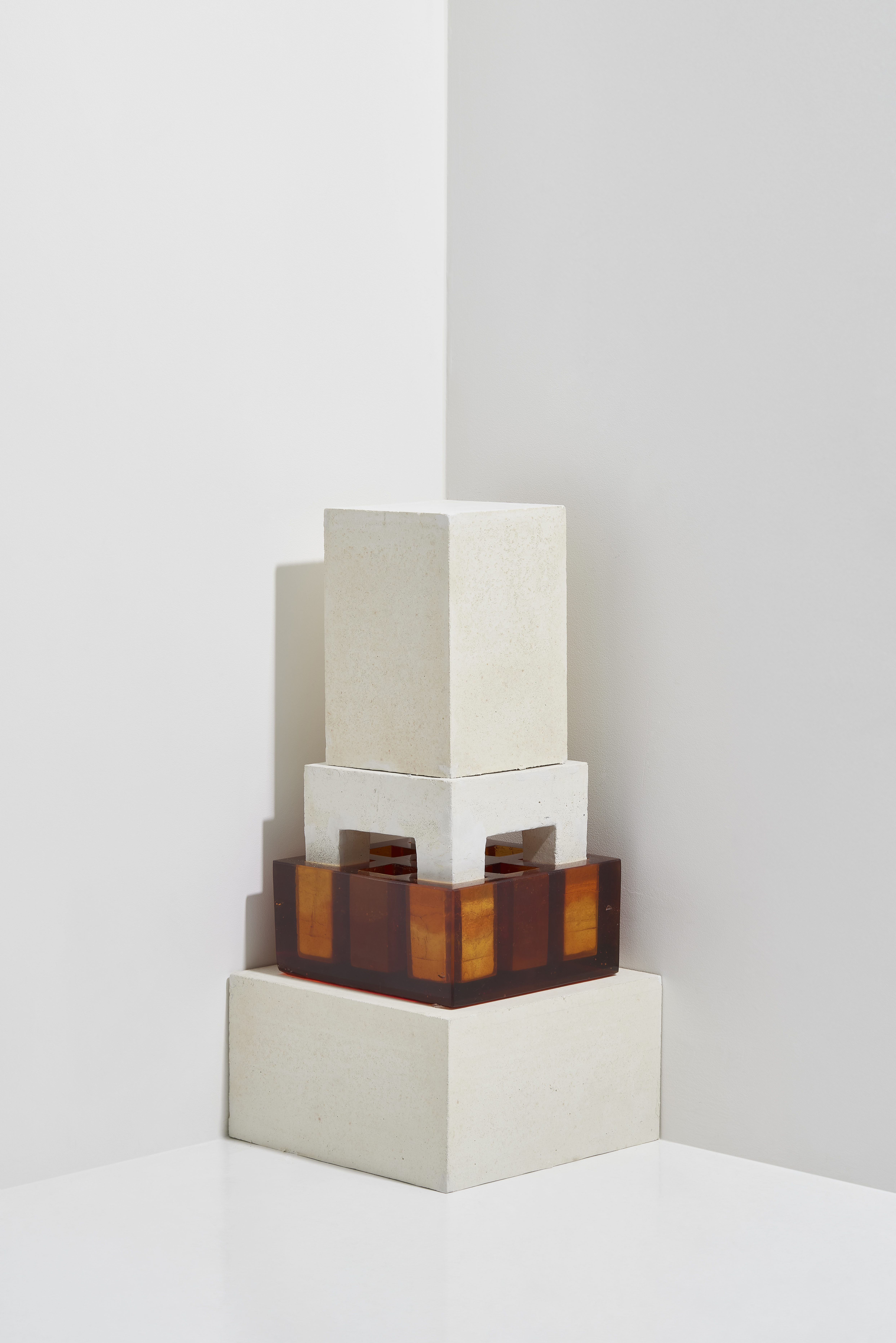 Untitled sculpture by oneg - cement and glass work exploring symmetry and body abstraction